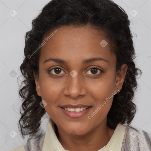 Joyful black young-adult female with medium  brown hair and brown eyes