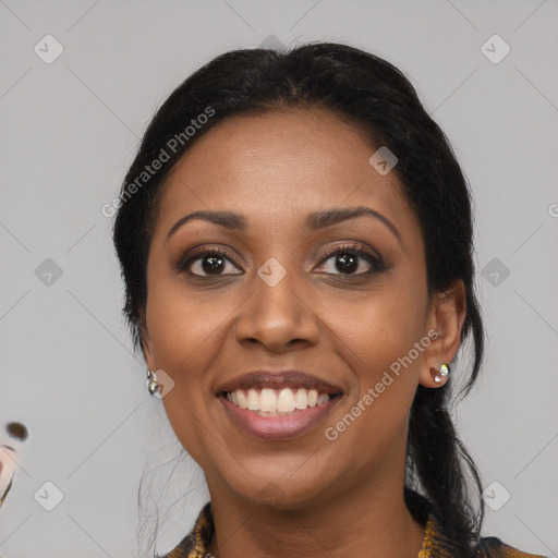 Joyful black young-adult female with medium  black hair and brown eyes