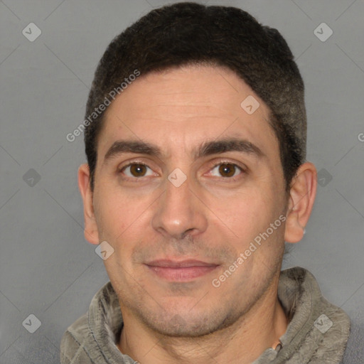 Joyful white adult male with short  brown hair and brown eyes