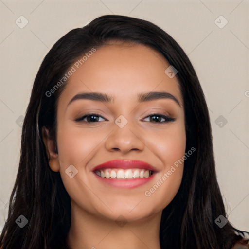 Joyful latino young-adult female with long  black hair and brown eyes