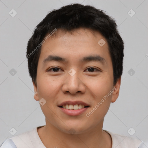 Joyful asian young-adult male with short  black hair and brown eyes