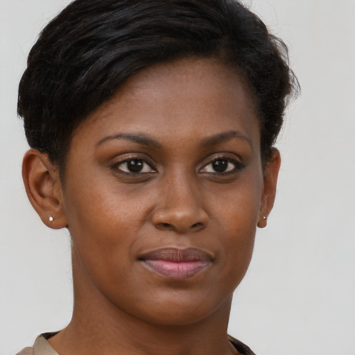 Joyful black young-adult female with short  brown hair and brown eyes