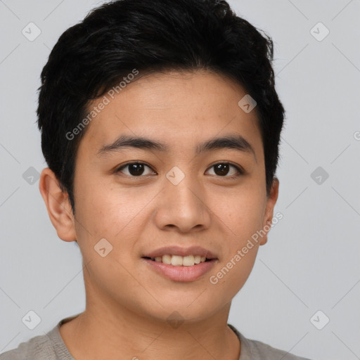 Joyful asian young-adult male with short  brown hair and brown eyes