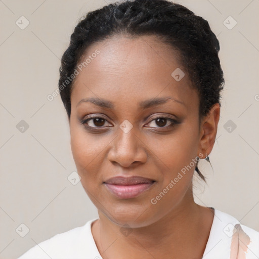 Joyful black young-adult female with short  black hair and brown eyes