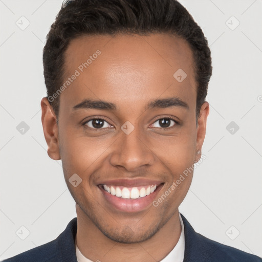 Joyful black young-adult male with short  brown hair and brown eyes