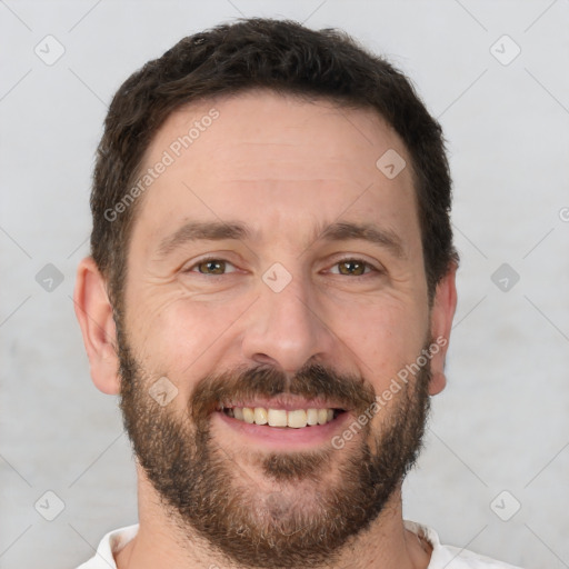 Joyful white adult male with short  brown hair and brown eyes