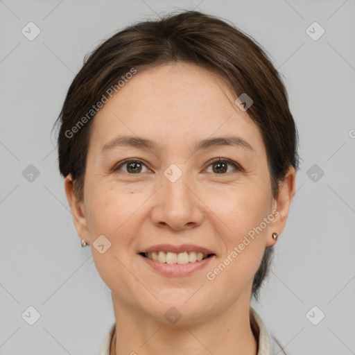 Joyful white adult female with medium  brown hair and brown eyes