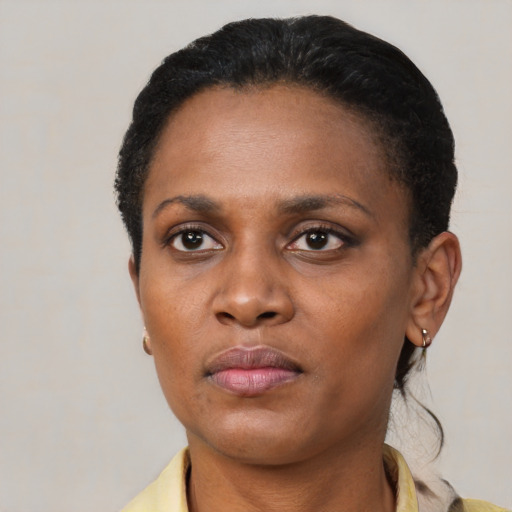 Neutral black adult female with short  black hair and brown eyes