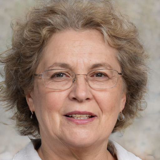 Joyful white middle-aged female with medium  brown hair and brown eyes