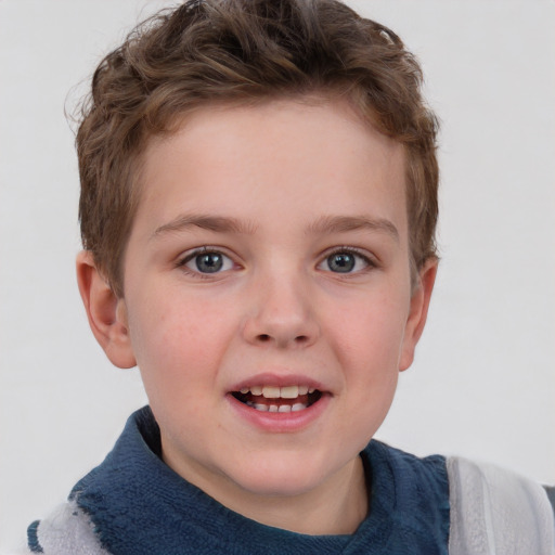 Joyful white child female with short  brown hair and blue eyes