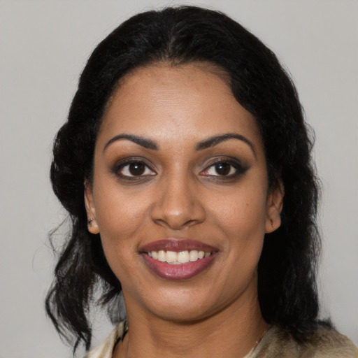 Joyful latino young-adult female with medium  black hair and brown eyes