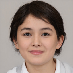 Joyful white child female with medium  brown hair and brown eyes