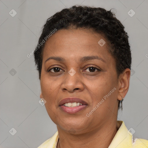 Joyful black adult female with short  brown hair and brown eyes