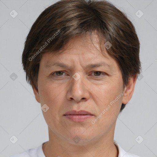 Joyful white adult female with short  brown hair and brown eyes