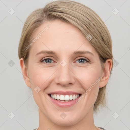 Joyful white young-adult female with medium  brown hair and blue eyes