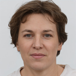 Joyful white adult female with short  brown hair and brown eyes