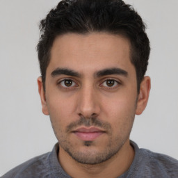 Neutral white young-adult male with short  black hair and brown eyes