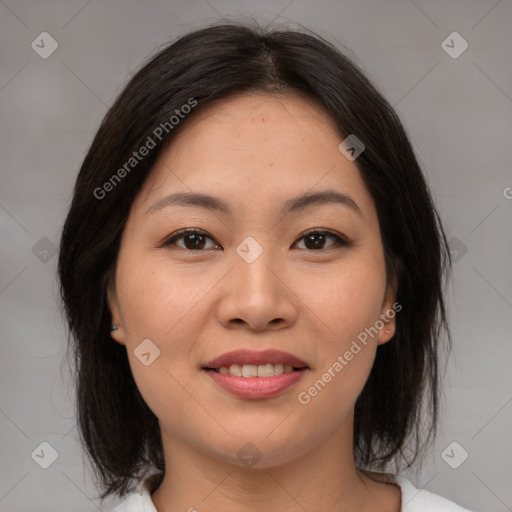 Joyful asian young-adult female with medium  brown hair and brown eyes