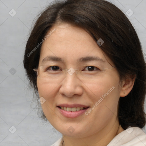 Joyful white adult female with medium  brown hair and brown eyes