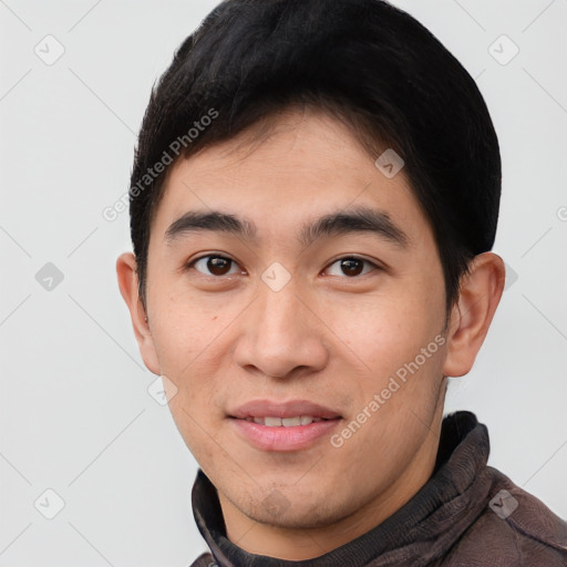 Joyful asian young-adult male with short  black hair and brown eyes