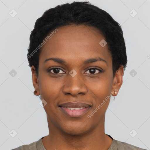 Joyful black young-adult female with short  black hair and brown eyes