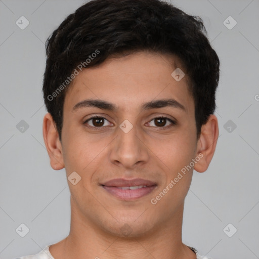 Joyful latino young-adult male with short  brown hair and brown eyes