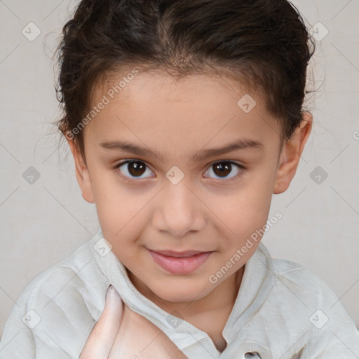 Joyful white child female with short  brown hair and brown eyes