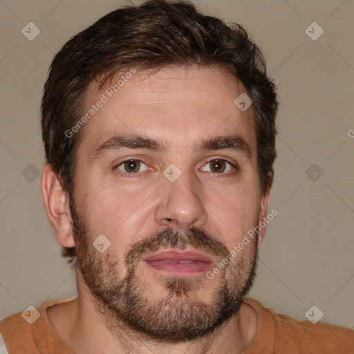 Joyful white adult male with short  brown hair and brown eyes