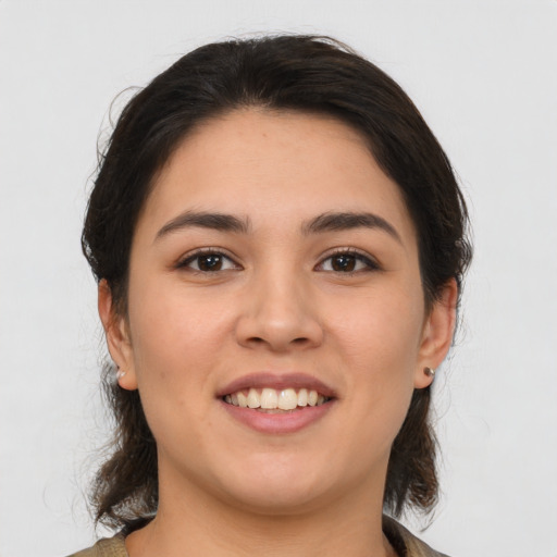 Joyful white young-adult female with medium  brown hair and brown eyes