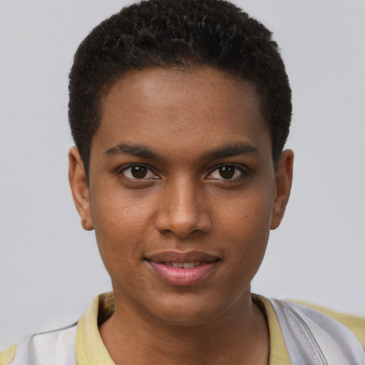 Joyful black young-adult male with short  brown hair and brown eyes
