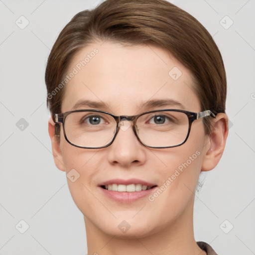 Joyful white young-adult female with short  brown hair and grey eyes