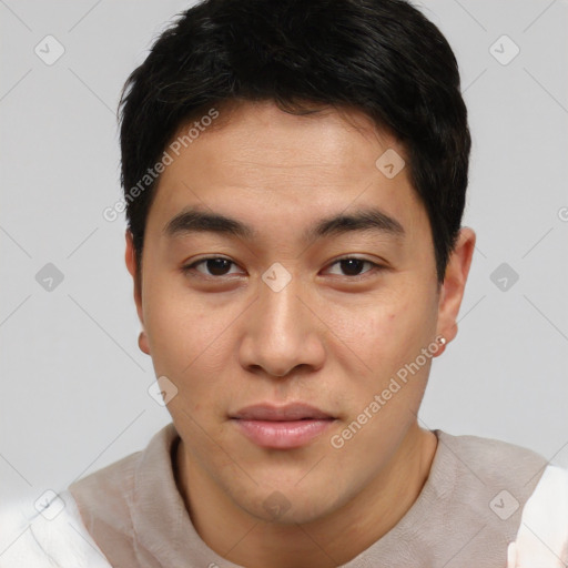 Joyful asian young-adult male with short  brown hair and brown eyes