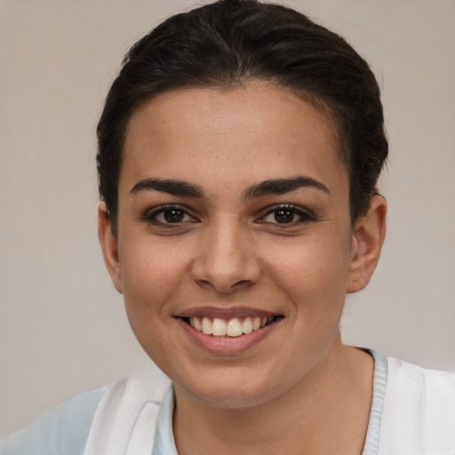 Joyful white young-adult female with short  brown hair and brown eyes