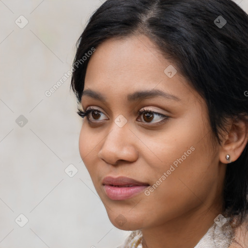 Joyful latino young-adult female with medium  black hair and brown eyes