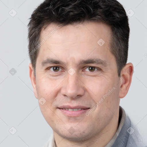 Joyful white adult male with short  brown hair and brown eyes