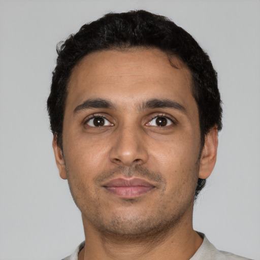 Neutral latino young-adult male with short  black hair and brown eyes