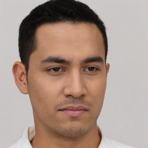 Neutral latino young-adult male with short  black hair and brown eyes