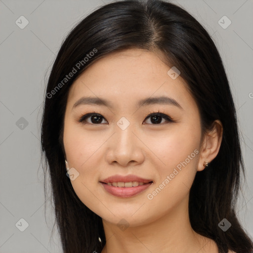 Joyful asian young-adult female with long  brown hair and brown eyes