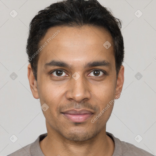 Joyful latino young-adult male with short  black hair and brown eyes