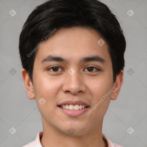 Joyful asian young-adult male with short  brown hair and brown eyes