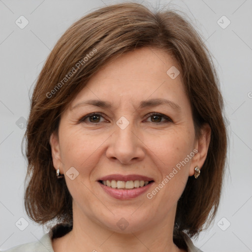 Joyful white adult female with medium  brown hair and brown eyes