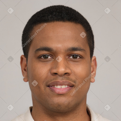 Joyful latino young-adult male with short  brown hair and brown eyes
