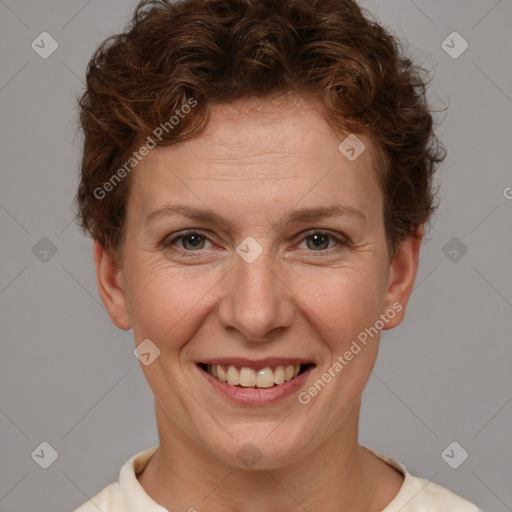 Joyful white adult female with short  brown hair and brown eyes