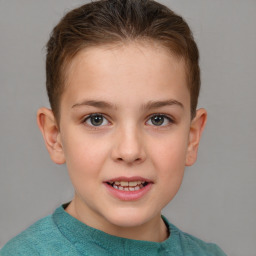 Joyful white child female with short  brown hair and grey eyes