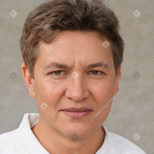 Joyful white adult male with short  brown hair and brown eyes