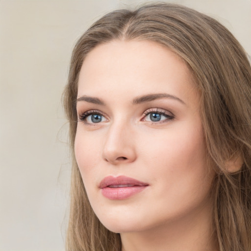 Neutral white young-adult female with long  brown hair and green eyes