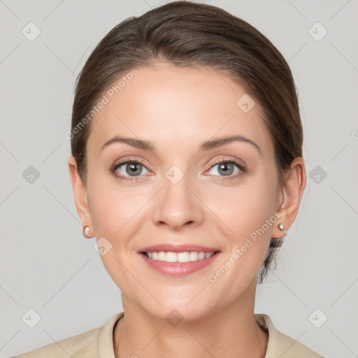 Joyful white young-adult female with medium  brown hair and grey eyes