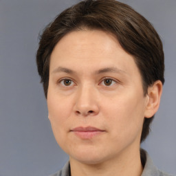 Joyful white adult female with short  brown hair and brown eyes