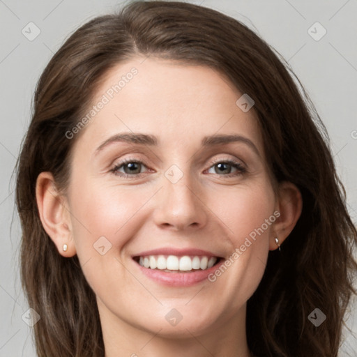 Joyful white young-adult female with long  brown hair and grey eyes