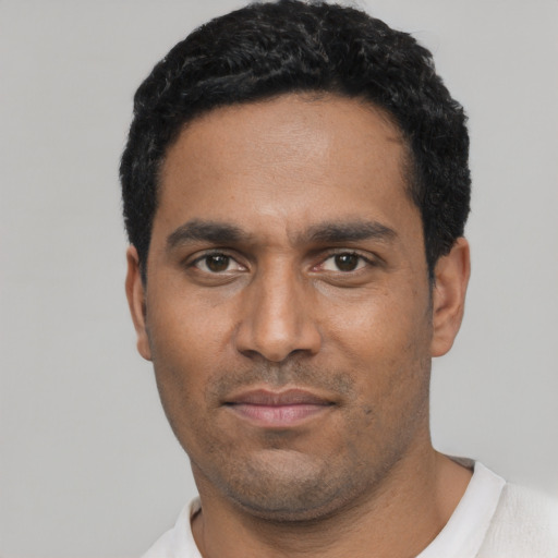 Neutral black young-adult male with short  black hair and brown eyes